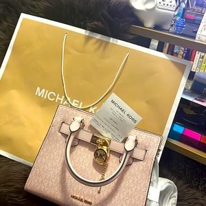 Micheal Kors satchels, light pink with lock. Never used bought from store.